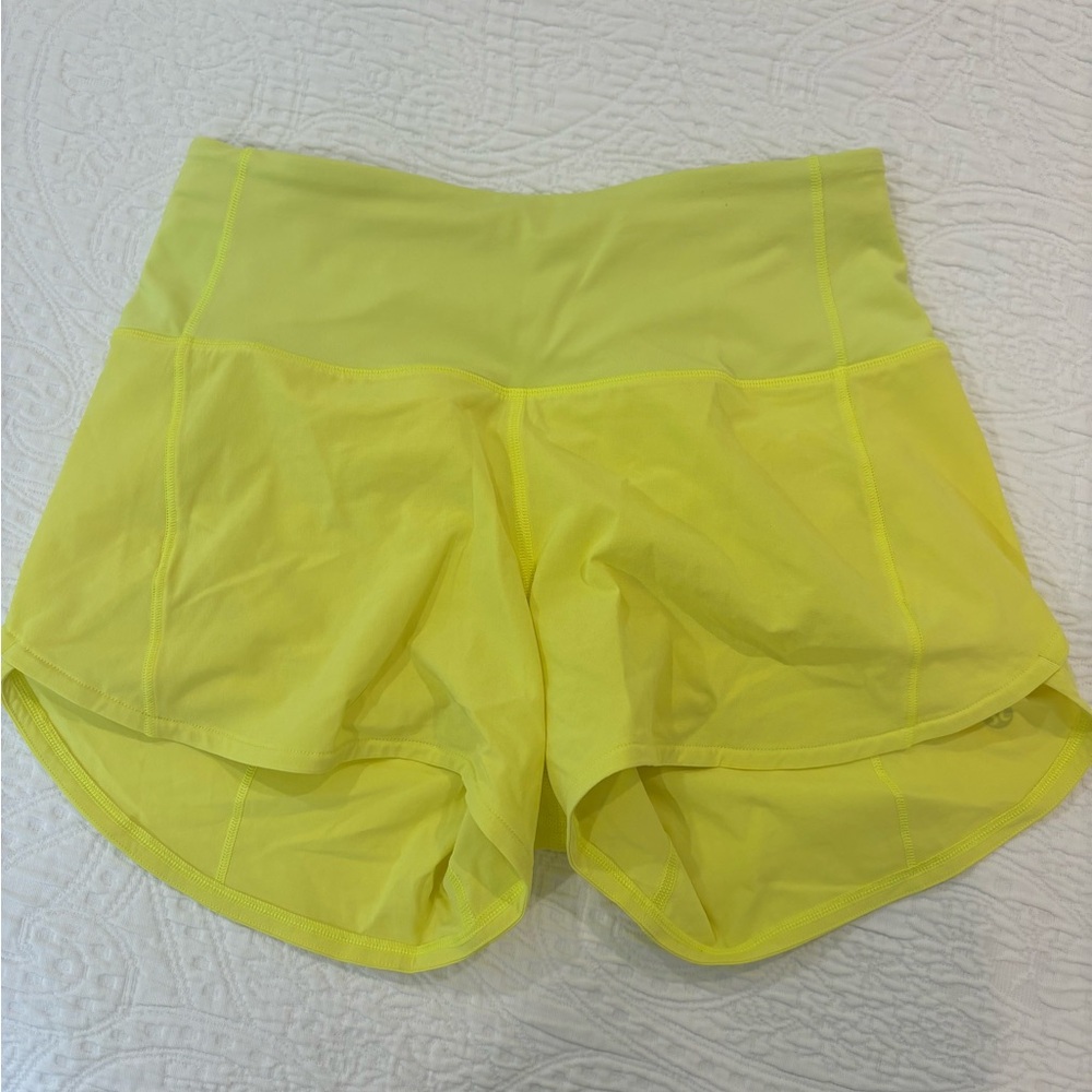 Worn once Lululemon yellow speed up shorts size 2